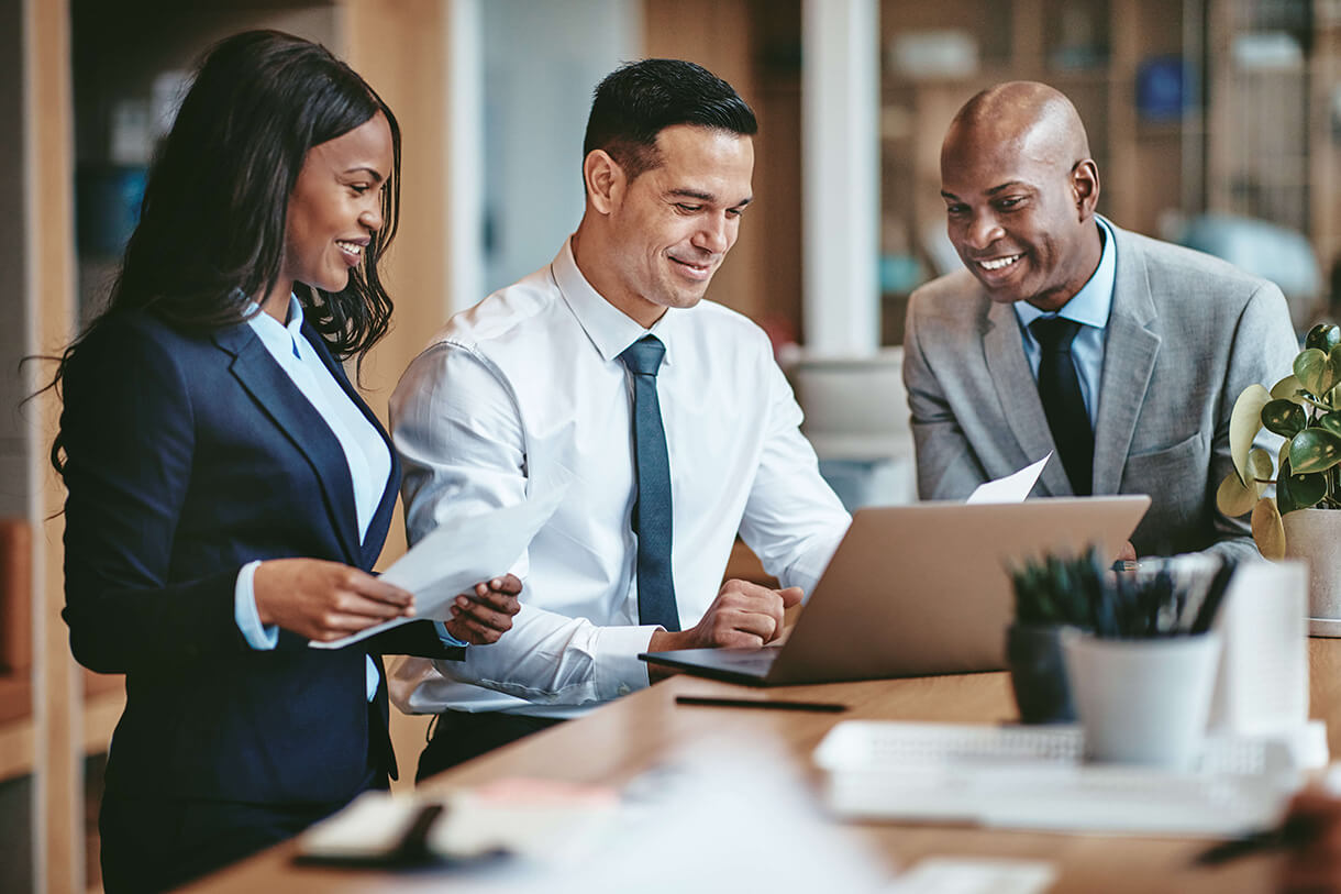 three employees working together